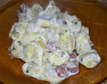 Tortellini with salami and basil